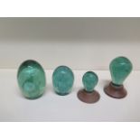 Two Victorian glass dumps - tallest 13cm - and two smaller ones on wooden bases possibly covering