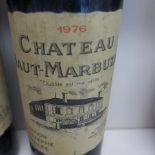 Two bottles of Chateau Haut-Marbuzet red wine 1978 - levels good on one, slightly low on the