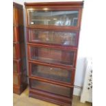 A mahogany five section glazed Globe Wernicke stacking bookcase one with label, all glass intact,