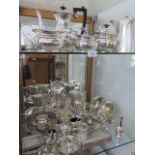 An interesting collection of silver plated items including a biscuit barrel, four piece tea set etc