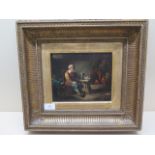 A 19th century oil on canvas of a man drinking in a village inn - in a gilt frame - 40cm x 37cm -