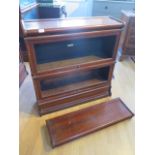 A mahogany two section glazed Globe Wernicke stacking bookcase one with label, both glass panels