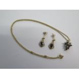 A 9ct yellow gold sapphire pendant on a chain and a pair of sapphire earrings - total approx