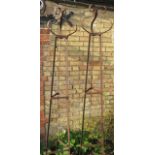 A pair of hand forged wrought iron triangular section garden obelisks with scroll finials - Width