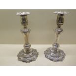 A pair of ornate embossed weighted silver candlesticks - Height 28cm - Sheffield Waterhouse Hodson &