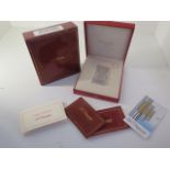 A silver Dupont lighter with box and paperwork - in good condition, engraved to cartouche