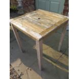 A hardwood weathered garden table - 70cm square