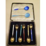 A boxed set of six silver enamel coffee spoons marked DA NORWAY STERLING - Two have small enamel