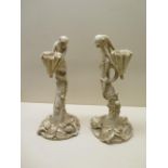 A pair of Royal Worcester ivory blush monkey candlesticks - Height 27cm - numbered 1140 - both