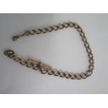 A yellow gold watch chain - Length 37cm - surface tests to approx 9ct - approx weight 52 grams -