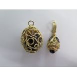 A stone egg in a gilt metal mount, mount approx 16 grams - Height 4cm - and a gilt metal pendant -