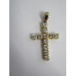 An 18ct (Tested) Yellow Gold Diamond Cross, approx. 1.5crts of Diamonds, approx. 29mms x 22mms,