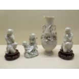 Three Parian ware figures, two on associated bases and a vase - Height 24cm - damage to vase and