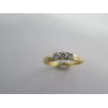An 18ct yellow gold three stone diamond ring size Q - approx weight 3.9 grams - diamonds bright