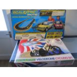 A Scalextric Velodrome boxed cycling set and digital driver boxed set - both look new