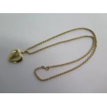 A 9ct yellow gold 54cm chain approx weight 13.5 grams - with a plated heart locket