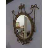 A 19th century gilt circular mirror - 60cm x 45cm