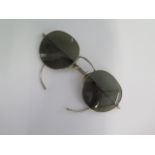 A pair of Aviator sun glasses