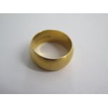 An 18ct yellow gold band ring size S - 9mm deep - approx weight 12.5 grams