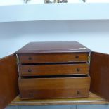 A mahogany two door collectors cabinet with three internal drawers - Height 24cm x 36cm x 31cm -