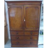 A 19th century mahogany linen press - the two door top enclosing four slides above a four drawer