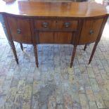 A Georgian mahogany sideboard with four drawers on ring turned supports - Height 92cm x 135cm x 50cm