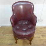 A good Victorian maroon leather revolving desk chair with a buttoned seat pad - Height 94cm x