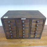 An 18 drawer collectors cabinet - Height 24cm x 36cm x 23cm - in polished condition