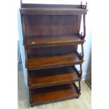 A modern mahogany waterfall bookcase - Height 161cm x 90cm x 41cm - in polished condition