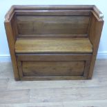 An oak box settle/pew with moulded upper rails and panelled below the storage seat - Height 84cm x