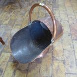 A copper helmet shaped coal scuttle - Height 47cm - with handle up