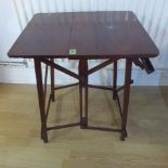 A mahogany folding side table - Height 69cm x 55cm x 45cm