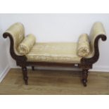 A Regency carved mahogany scroll end recently reupholstered window seat on turned shaped octagonal