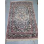 A silk pile rug with a cream field and stylized boarder - 200cm x 120cm - some slight wear but