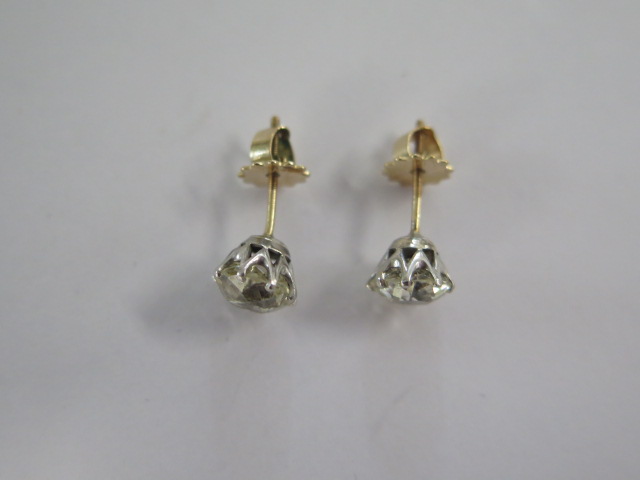 A pair of diamond stud earrings in gold and white metal settings with screw backs - each diamond - Image 3 of 3