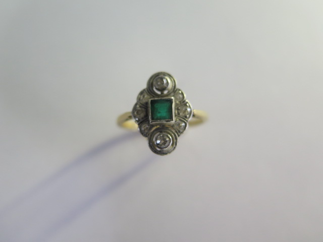 An 18ct yellow gold diamond and emerald ring size L -approx weight 3 grams - head approx 14mm x 10mm