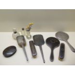 Six silver and tortoiseshell backed dressing table mirrors and brushes, a box and three silver rim