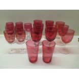 A collection of 16 cranberry wine glasses and two tumblers - all good except one chipped to base