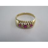 An 18ct yellow gold hallmarked diamond and ruby type five stone ring size N/O - approx weight 2.9