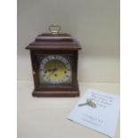 A Comitti of London mahogany mantle clock with Hermle chiming movement in good working order -