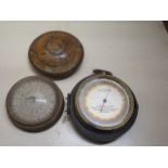 A Norton & Co pocket barometer in part case and a compass in treen box - Width 5.5cm