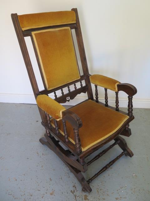 A reupholstered American rocking chair - Height 104cm x Width 60cm - in good condition