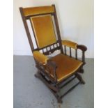 A reupholstered American rocking chair - Height 104cm x Width 60cm - in good condition