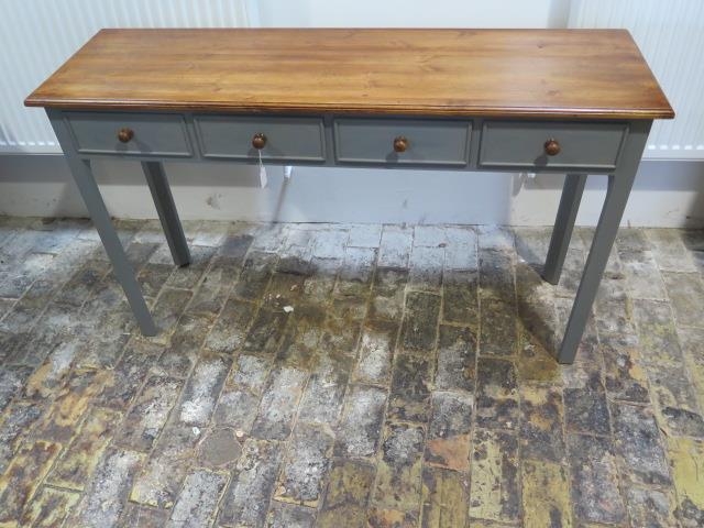 A new painted four drawer hall table with a polished pine top made by a local craftsman to a high