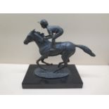 A bronze Jockey on horseback entitled Champion Finish signed David Cornell 1985 - Height 20cm - in
