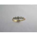 An 18ct yellow gold and platinum five stone diamond ring size S - approx weight 2.4 grams - diamonds