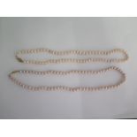 Two 46cm strings of pearls with 9ct clasps