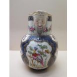 A 19th century mask jug decorated with exotic birds and insects - Height 21cm - some wear to gilt