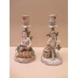 A pair of figural porcelain candlesticks fisherman and bird catcher - Height 20cm - both with AR