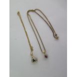A 9ct pendant on a fine gold chain and a gilt metal pendant on a 9ct chain - total weight approx 7.6